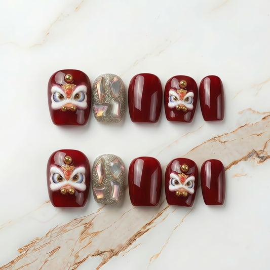 nails are ready to lunar new year. Lumi Loop Lucky Red dancing lion press-on nails for Lunar New Year. sparkle base gel with shining gem base with festive red  accents, handmade short square shape.