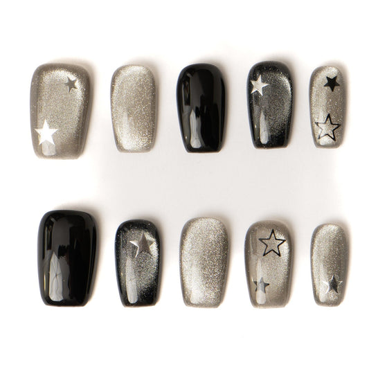 Lumi Loop handmade press-on nails full set in Midnight Star, featuring black and silver cat eye gel with star nail art.