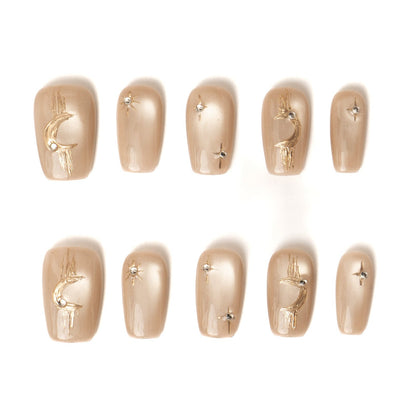 Lumi Loop handmade press-on nails full set in Celestial Bronze, featuring cat eye gel and gold moon star art.
Thumb Detail	nail art detail